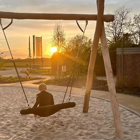 Family Near Lake, And Dunes *